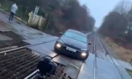 car parked on level crossing near bolton