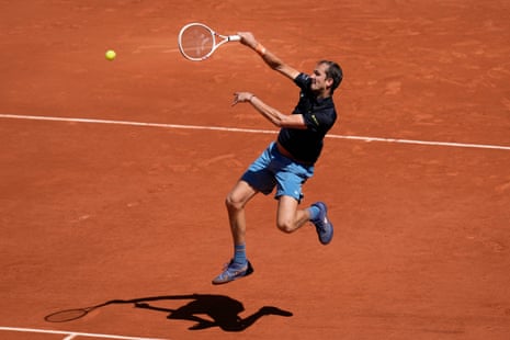 Daniil Medvedev of Russia returns to Adam Walton of Australia