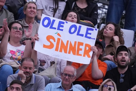 Jannik Sinner supporters hold up a banner saying “Olé olé Sinner”