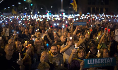 Protesters stage a candlelight protest on a main road in Barcelona over the arrest of two pro-independence leaders