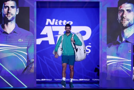 Novak Djokovic walks on to court in Turin.