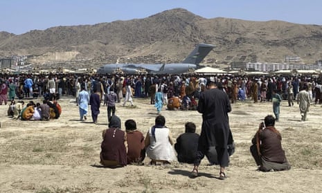 People at Kabul airport seeking to flee the Taliban