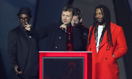 Damon Albarn, centre, and his group Gorillaz, collecting the best British band award.