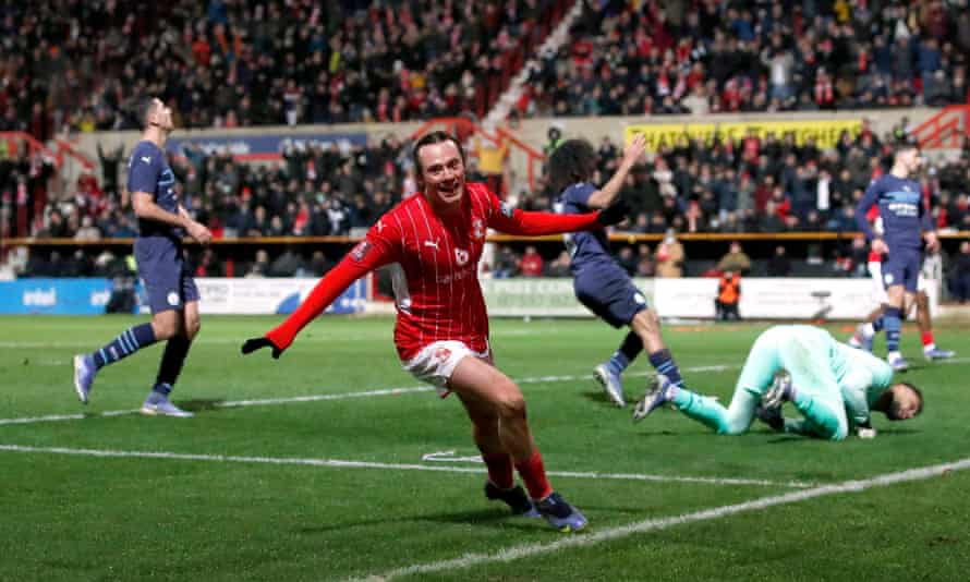 Harry McKirdy shows his delight after scoring for Swindon.