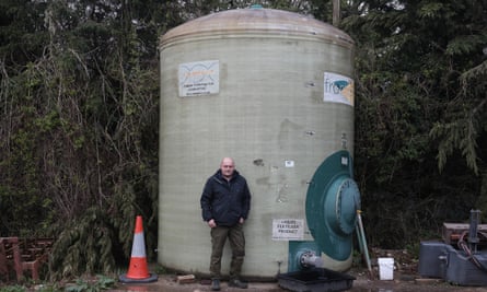 Matt Culley stands in front of a fertiliser tank