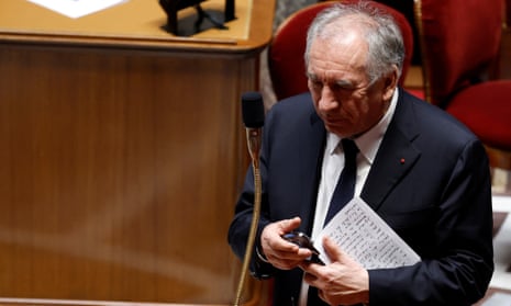 French prime minister Francois Bayrou leaves after he delivered his speech to the National Assembly.