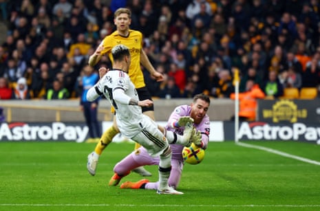 Wolverhampton Wanderers' Jose Sa blocks a shot from Manchester United's Antony.