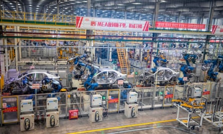 Robots assemble cars in an electric car factory in  China