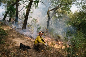 Rick O’Rourke, Yurok fire practitioner and fire and fuels coordinator for the Cultural Fire Management Council, with his dog Puppers during the prescribed burn in Weitchpec.