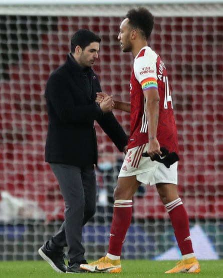Mikel Arteta consoles captain Pierre-Emerick Aubameyang after after a match against Burnley in 2020