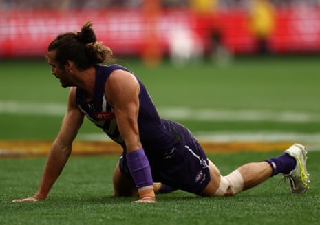 The Dockers captain struggles to get up on to his feet