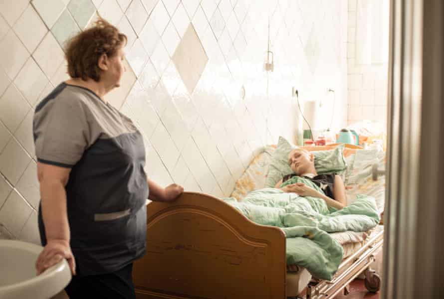 Tetiana Pidbutska, a senior nurse on the neurosurgery ward, with Diana in hospital