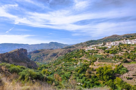 A white village on a hillside in sunny Spain.