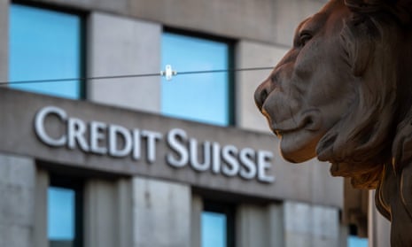 A sign of Credit Suisse bank is seen on a branch building in Geneva.