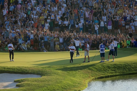 Justin Rose and the European team celebrate on the 16th green after the putt to win the match against Jordan Spieth and Justin Thomas