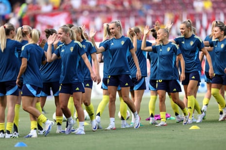 Sweden’s players begin their warm-up with some high-five drills.
