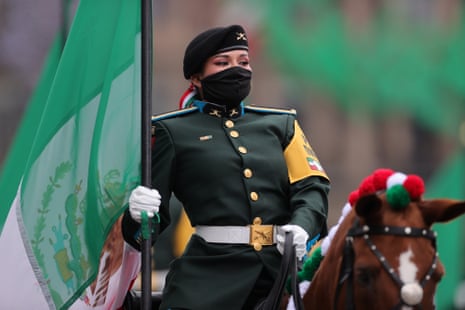 Soldiers wear masks during the Independence Day military parade at Zocalo Square in Mexico. This year El Zocalo remains closed for general public due to coronavirus restrictions.