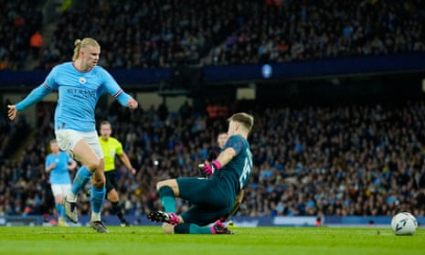 Manchester City’s Erling Haaland (left) scores his side’s opening goal.