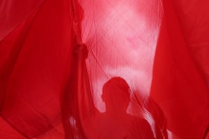 Hong Kong, ChinaA pro-China supporter stands behind the Chinese national flag at a celebration of the 28th anniversary of Hong Kong’s handover to Chinese rule
