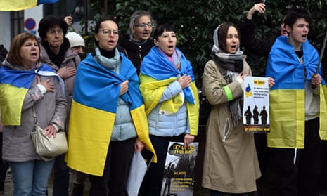 Ukrainian people take part in a demonstration in solidarity with Ukraine and demanding 'change the strategy of supplying arms to Ukraine and impose sanctions against Russia' at Schuman Square in Brussels.