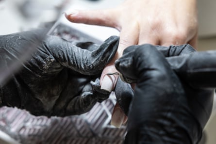 Alina Huck gives a Russian manicure to Marija at her studio in Alexandria, NSW, Australia
