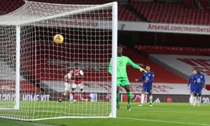 Chelsea goalkeeper Edouard Mendy watches as a cross from Bukayo Saka of Arsenal bounces off the crossbar and goes in.