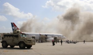 Dust rises after the explosions at Aden airport