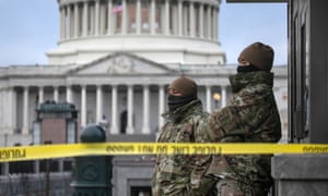 National Guard troops stand watch at the US Capitol on Friday in Washington DC.