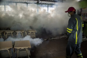 A classroom is sprayed at a school in in Santa Tecla, El Salvador