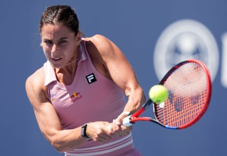 Emma Navarro hits a return to Emma Raducanu during their Miami Open match