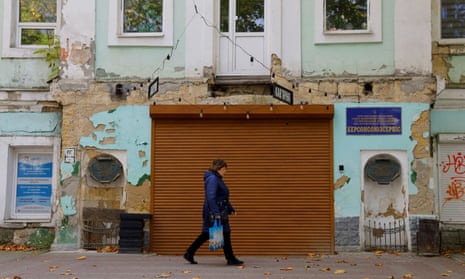 A woman walks in a street in Kherson last Monday