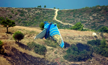 The tail fin of the Boeing 737 – the most intact part of the plane – at the crash site near Athens