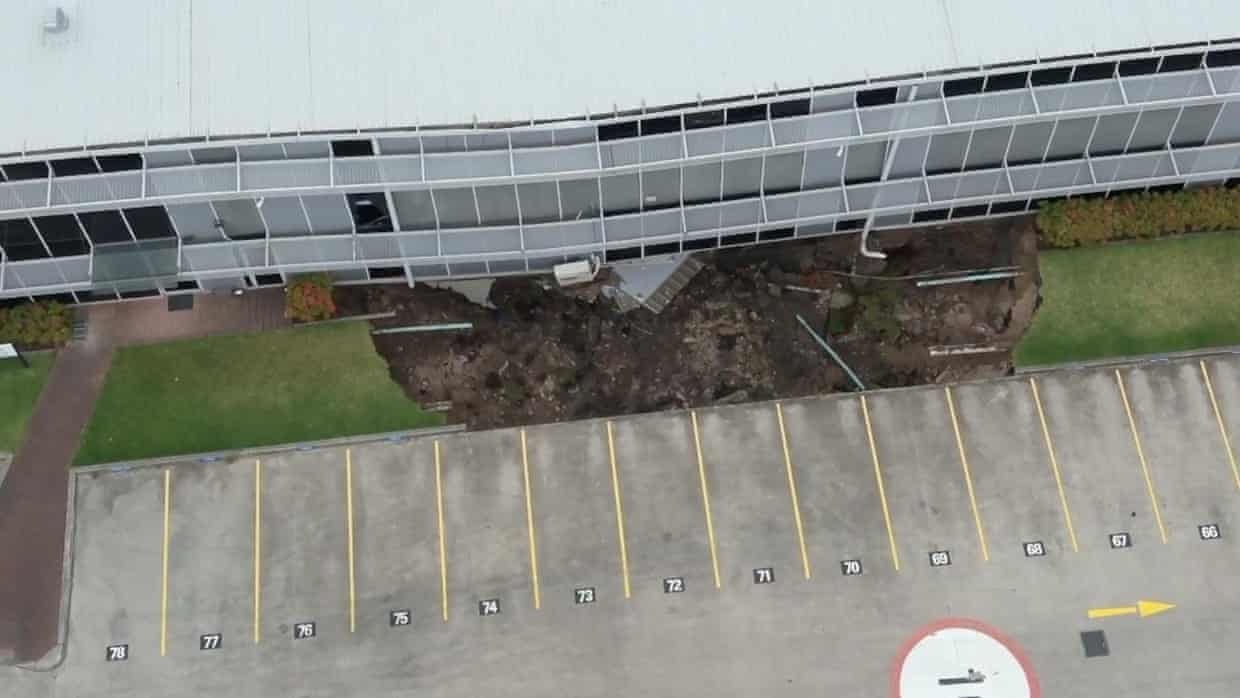 Drone vision shows sinkhole beneath Sydney building – video