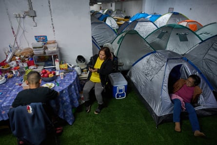 People shelter underneath Tel Aviv’s central bus station as a precaution against Iranian aerial attacks on 12 March 2026.
