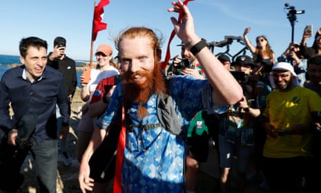 Russ Cook reacts after becoming the first person to run the entire length of Africa.