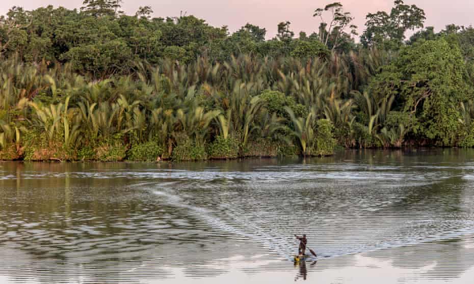 A man paddles a canoe on the Sepik River in Papua New Guinea