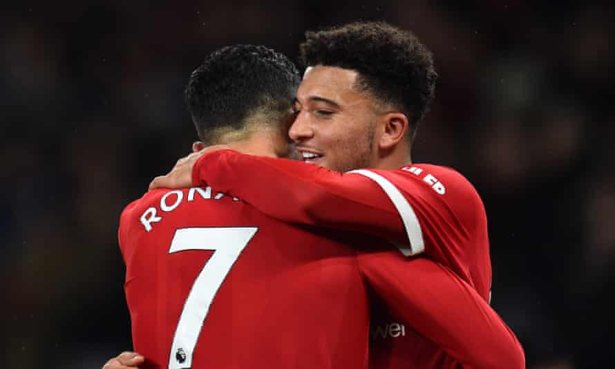 Cristiano Ronaldo celebrates with Jadon Sancho