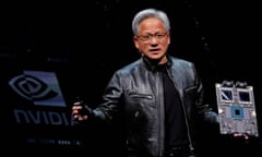 A man is lifting computer hardware on stage