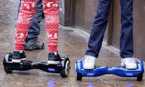 Teenagers using hoverboards in London, Britain.