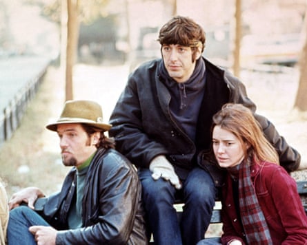 Pacino and Kitty Winn sat on a park bench looking worried