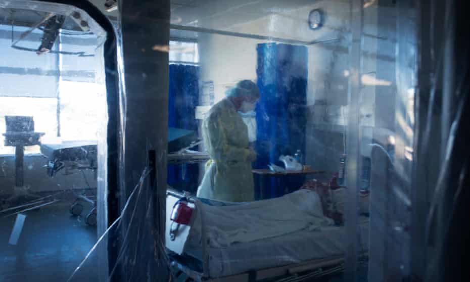 A doctor consults with a patient in a vacuum separated Covid-19 section at St Vincent’s Hospital, Sydney, Australia.
