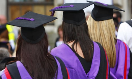 Rear view of female students in gowns and mortar boards