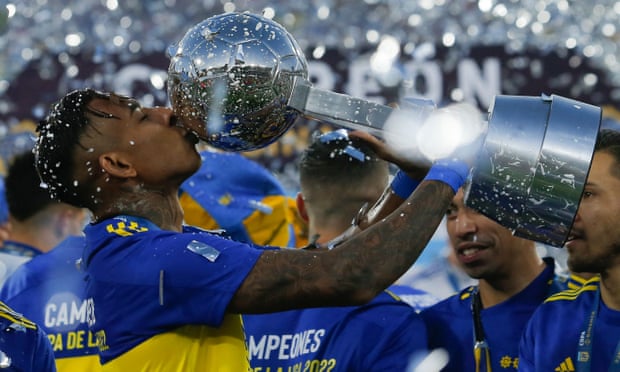 Boca Juniors celebrate with the trophy after winning the 2022 Copa de la Liga final.