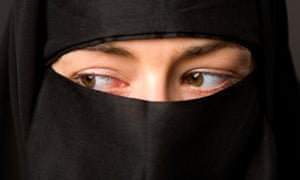 A woman in a black veil.