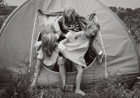 Mary Nolan’s Tessa, Celia and Alice emerging from a tent on a trip through France.