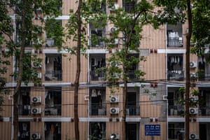 A block of flats with trees in front of it