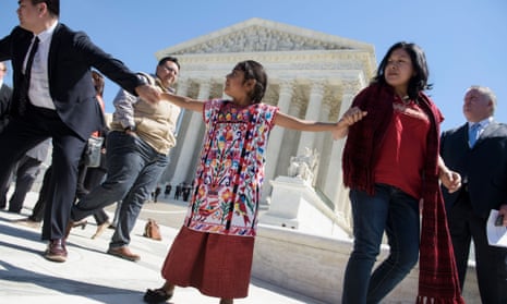 Sophie Cruz of Los Angeles, and other supporters of President Obama’s immigration reforms leave the US supreme court on Monday.
