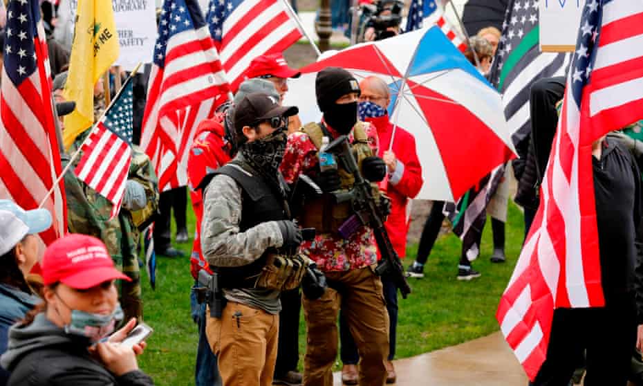 Armed protesters during a demonstration in Lansing, Michigan, on 30 April. 