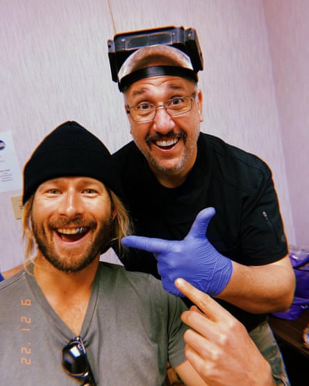 Gary Archer, right, with actor Glen Powell, creating dental prosthetics for the film Hit Man.