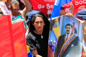 Supporters gather holding banners and flags during a demonstration in support of Nicolas Maduro, in Caracas.